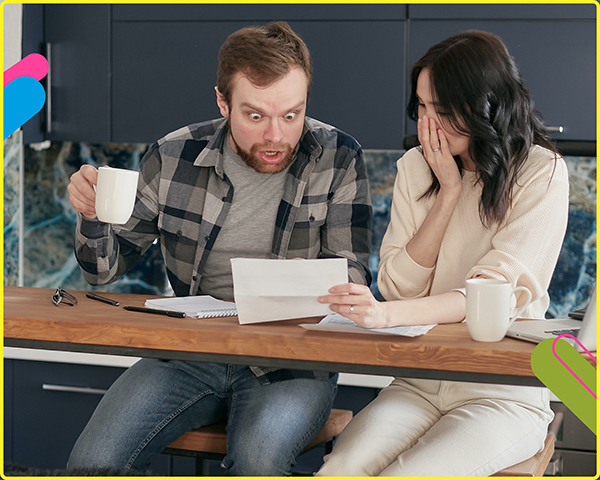 man and woman frightened by a document